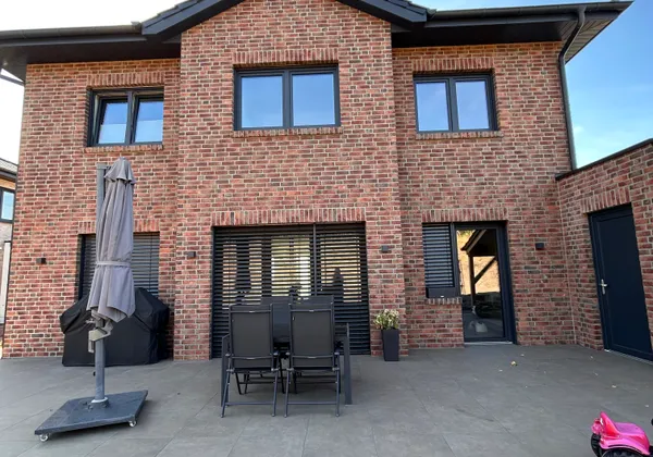 Einfamilienhaus mit Carport in Lohne, Terrasse mit Klinkerfassade